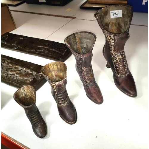 174 - A set of graduating ladies boots, vases/measures  ht. largest 23cm, smallest 11cm