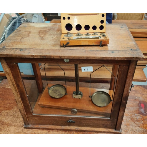 175 - A mahogany cased scientific balance by Philip Harris and a cased set of weights