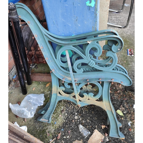 186A - A pair of cast metal bench ends in green