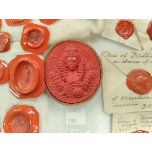 299 - A 19th century red was seal of Queen Elizabeth I, gilt surround, 6.3cm and a collection of 19th cent... 