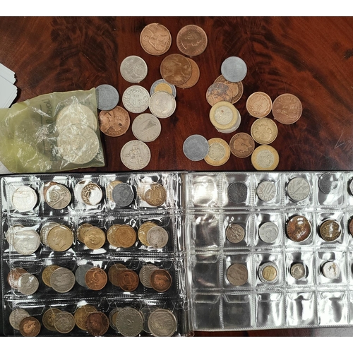 323A - An album and loose world coins, some silver content, some WWII German examples.