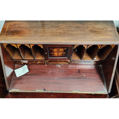 964 - A Sheriton style inlaid mahogany    desk with inlaid interior, fitted cupboard, inset cent... 