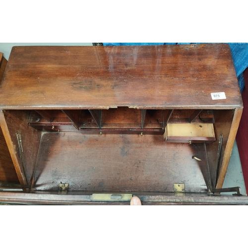 975 - A mahogany full front bureau, brass drop handles, three drawers bellow, fitted interior.