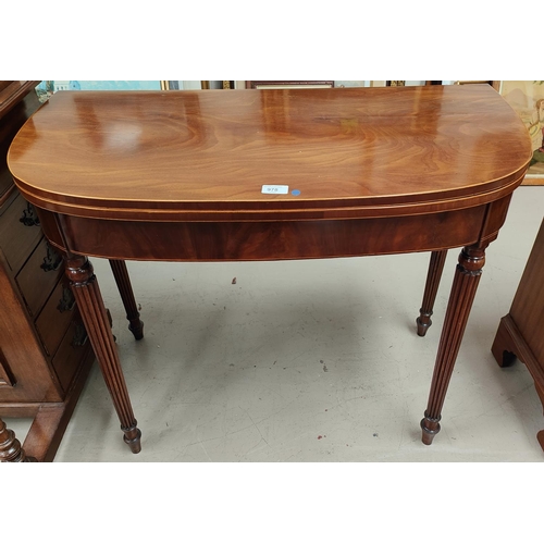 978 - A late 18th century mahogany card table with boxwood and ebony line inlay, the 'D' fold over top wit... 