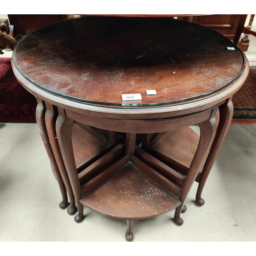 982 - A 1930's nest of tables comprising circular table and 4 quarter tables