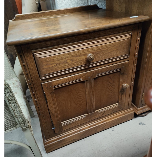 994 - A modern light wood Ercol side unit with cutlery drawer and cupboard below