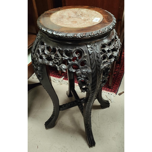 996 - A Chinese carved and pierced hardwood vase stand inset antico rosso marble top, 30cm diameter of top... 