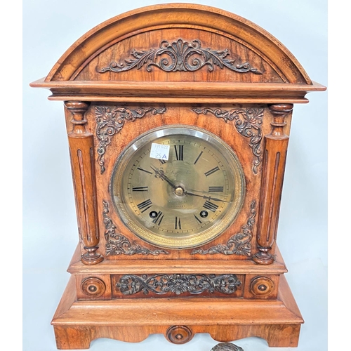 25A - A walnut cased mantle clock by William Battersby of Manchester with brass dial and striking movement... 