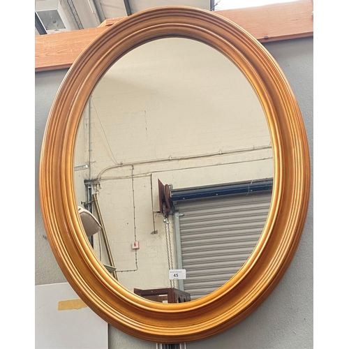 45 - An oval gilt framed wall mirror and other pictures and prints; table lamps