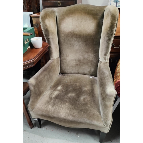 953 - An Edwardian wingback armchair, later upholstery