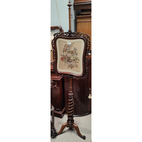 967 - A rosewood pole screen with rosewood framed tapestry picture of flowers, corkscrew pole