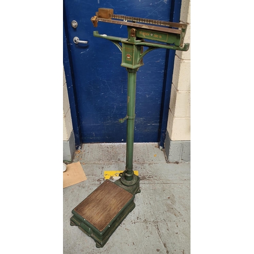 970 - A set of early/mid century medical weighing scales in green with Royal Crown decoration, H Feredey &... 