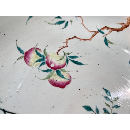 449 - A large 19th century Chinese charger decorated with branches and pomegranates to top, mountain scene... 