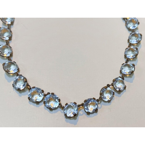 623 - A necklace of early 20th century clear paste stones 80cm