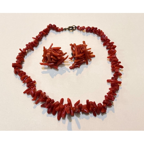 627 - A coral necklace + a matching pair of clip earrings, necklace weight 20gms.