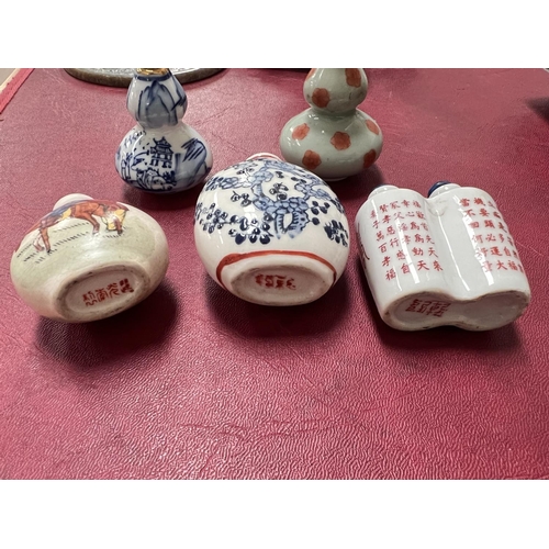 472 - A collection of 5 Chinese porcelain snuff bottles of various types and sizes