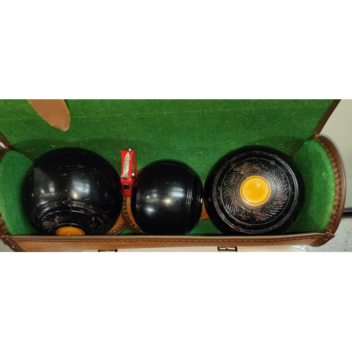 118B - A silver plated bowling trophy and two sets of bowls, a bible and cased box camera 