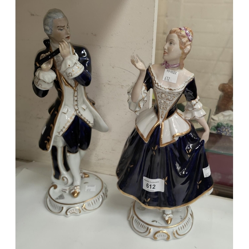 612 - A pair of Royal Dux figures: lady and gentleman in 18th century dress