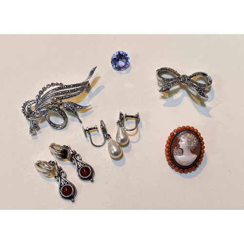 695 - A cameo brooch surrounded by coral beads; a pair of silver clip earrings with amber cabochon and sil... 