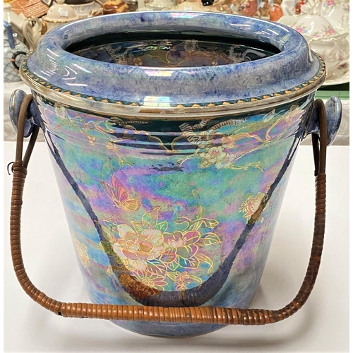 559 - An early 20th century 'Byzanta ware' by Grimwades Primrose purple lustre slop bucket with woven wood... 