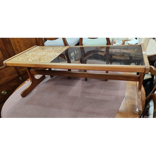 1010 - A 1960's teak coffee table with glass and tile top