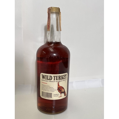 400I - A litre bottle of Austin Nichols WILD TURKEY Kentucky Styraight Bourbon whisky 50.5%vol, level low n... 