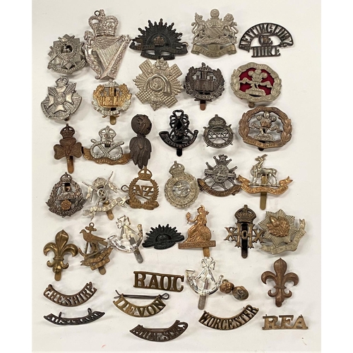 373 - A selection of military badges and buttons