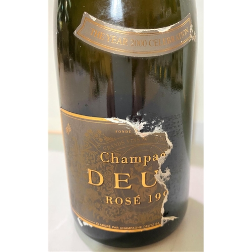 418 - A bottle of Chapagne Deutz Rose 199? (The Year 2000 Celebration)(Label partly torn)