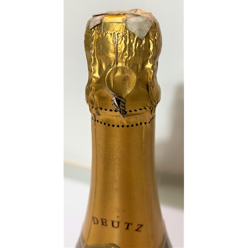 418 - A bottle of Chapagne Deutz Rose 199? (The Year 2000 Celebration)(Label partly torn)