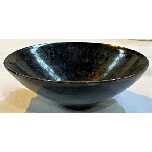 468A - A Chinese dark glazed bowl with small foot, leaf decoration in the glaze, 15cm dia