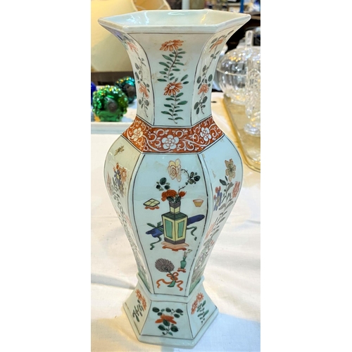 470 - A Chinese famille vert hexagonal shaped baluster vase decorated with vases, flowers etc, ht. 28cm