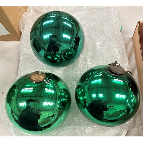 Three vintage green glass silvered mirror witch balls, 14cm diameter