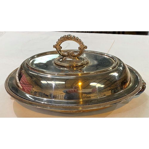 668 - A silver plated oval entree dish with beading; other silver plate