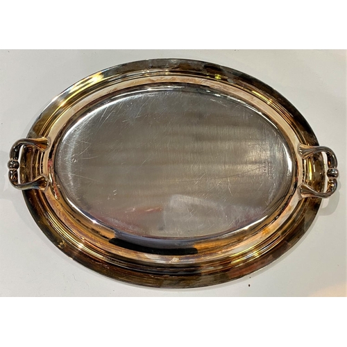 668 - A silver plated oval entree dish with beading; other silver plate