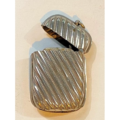 671 - A hallmarked silver 6 division arched toast rack, Birmingham 1933, 2.75oz; a hallmarked silver candl... 