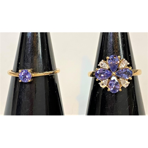 681 - A 9 carat hallmarked gold dress ring set 4 pear shaped tanzanites, total 1.68 carat, and 4 smaller p... 