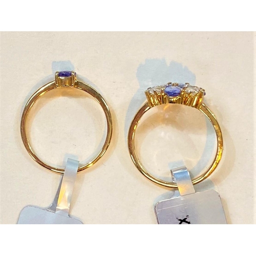 681 - A 9 carat hallmarked gold dress ring set 4 pear shaped tanzanites, total 1.68 carat, and 4 smaller p... 