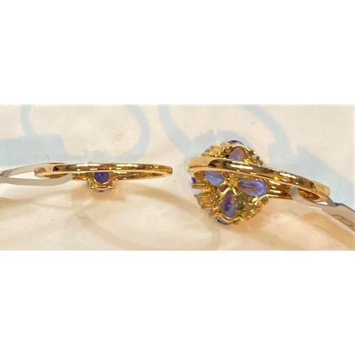 681 - A 9 carat hallmarked gold dress ring set 4 pear shaped tanzanites, total 1.68 carat, and 4 smaller p... 