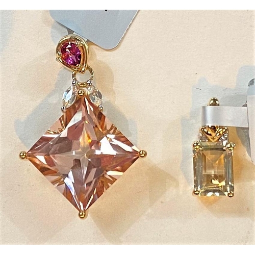 685 - A 9 carat hallmarked gold pendant set large Galileia topaz, 11.92 carat, with 2 white zircons and a ... 