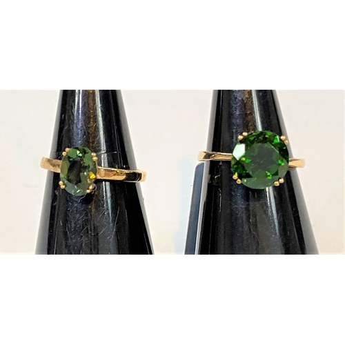 691 - A 9 carat hallmarked gold dress ring set large circular chrome diopside in brilliant green, 2.84 car... 