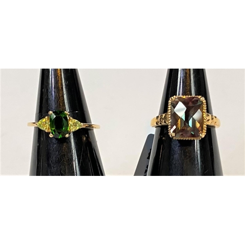 692 - A 9 carat hallmarked gold dress ring set green rectangular andesine, 2.91 carat, 10 x 8mm, size L/M,... 