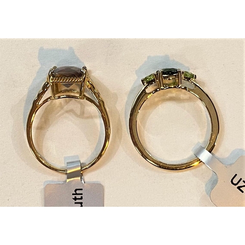 692 - A 9 carat hallmarked gold dress ring set green rectangular andesine, 2.91 carat, 10 x 8mm, size L/M,... 