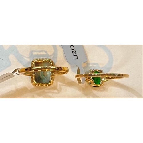 692 - A 9 carat hallmarked gold dress ring set green rectangular andesine, 2.91 carat, 10 x 8mm, size L/M,... 