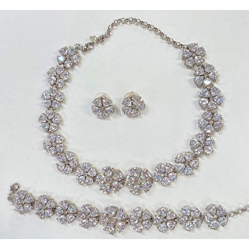 703 - Butler & Wilson:  a 'Daisy' design matching jewellery set in clear crystal with necklace, f... 