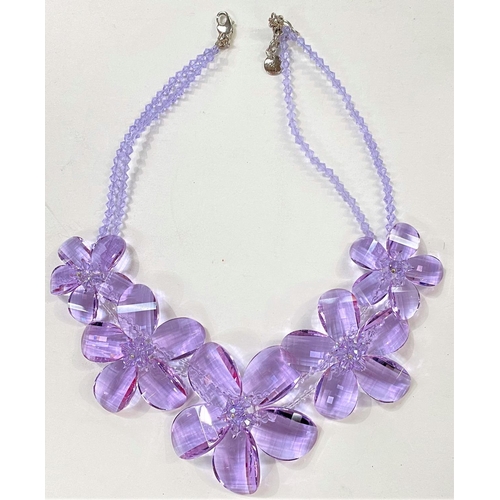 704 - Butler & Wilson:  a necklace in the form of 5 graduating faceted crystal pale purple flower... 