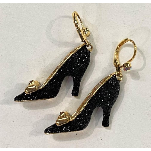 705 - Butler & Wilson:  a pair of earrings in the form of black glittery high heel shoes, with gi... 