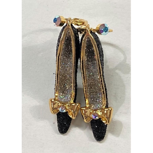 705 - Butler & Wilson:  a pair of earrings in the form of black glittery high heel shoes, with gi... 