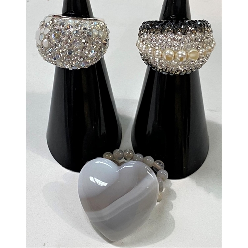 710 - Swarovski:  a fancy cocktail ring set multi-crystals and opaque white stones, size L (1 small s... 