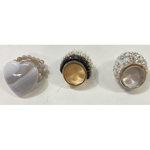 710 - Swarovski:  a fancy cocktail ring set multi-crystals and opaque white stones, size L (1 small s... 