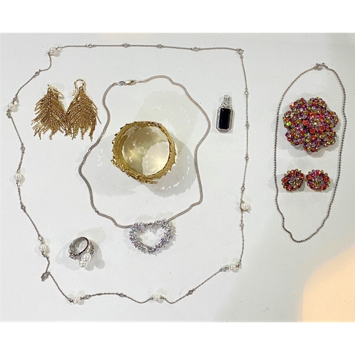 714 - A selection of costume jewellery:  a gilt diamante leaf/feather bangle; feather earrings; diama... 